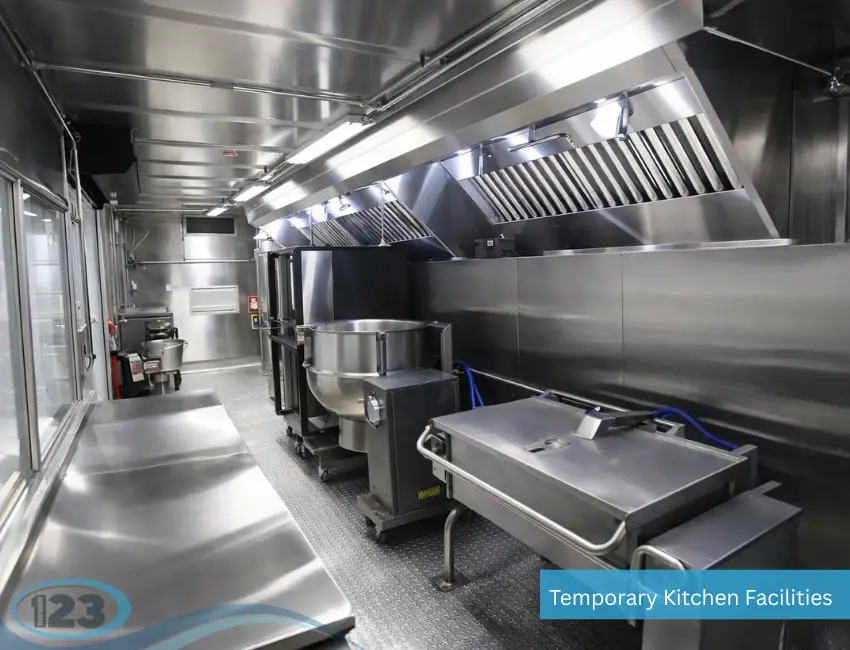 Mobile kitchen trailer interior with stainless steel sink and food preparation area